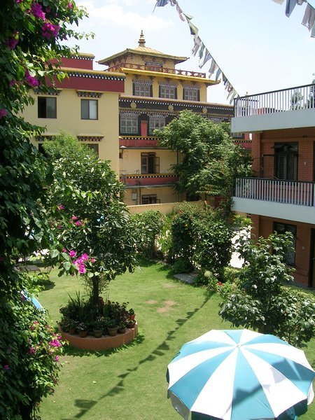 The garden of Shechen Guesthouse where I stayed in Boudha with the monastery in the background.