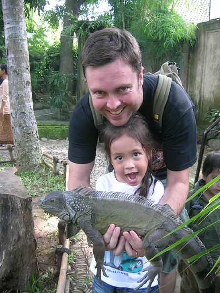 Tasha and Toby with a water monitor at the Bali reptile park.