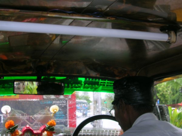 I thought that the fluro strip in the taxi and the drivers black plastic bag as a rain hat was novel in Mumbai.