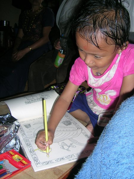 Sushmita loved her colouring book and pencils.
