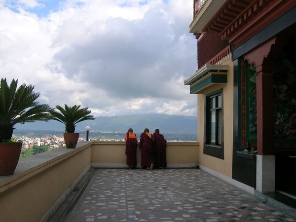 Three monks, also enjoying the view.