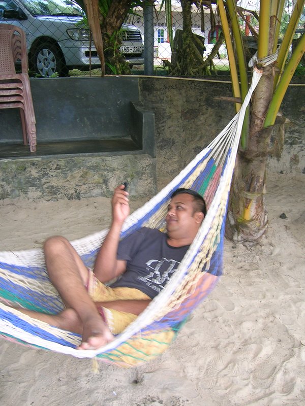 Sam my driver and guide resting in MY hammock.