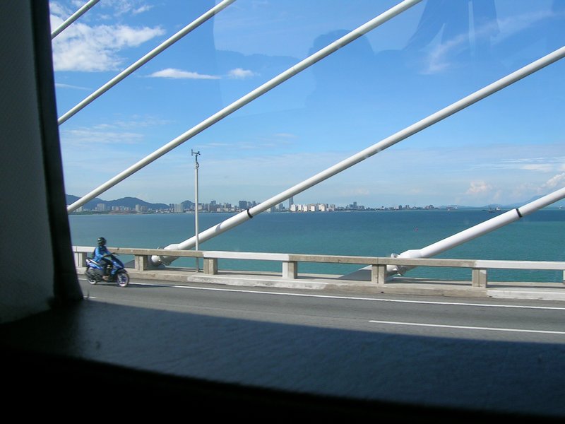 On the bridge across to Peneng with a beautiful cleasr blue sky.