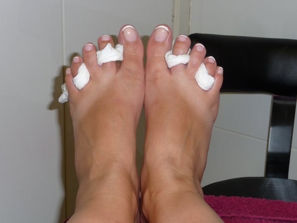 The flip-flop tan lines on pampered feet