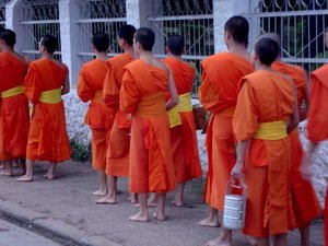 Monks collecting food