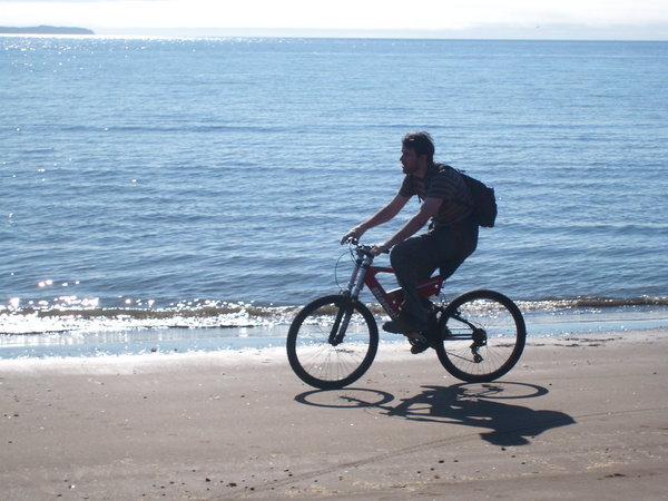 Biking on the beach near Ancud