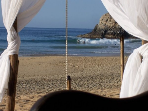 swinging seats on the sand en la playa desnudo Zipolite