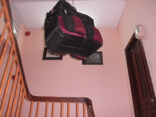 Luggage Going Up To Our Room at Mme Cuc's Hotel