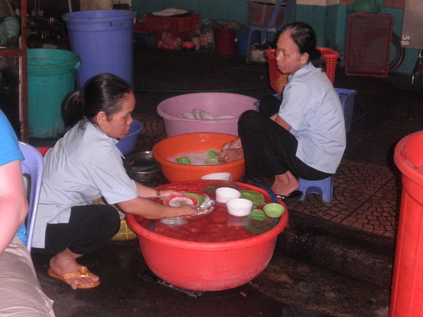 Ladies Doing the Dishes at The Outdoor Food Market