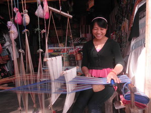 A Young Lady Who Hand Weaves Scarves of Silk and Cotton
