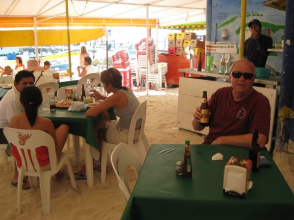 Raymondo enjoying a cold cervez at a beach restaurant 