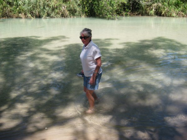 Marsia wading the waters at Agua Azul