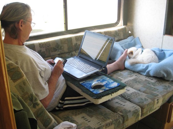 Marsia multi-tasking  texting, blogging and nursing her wounded foot.