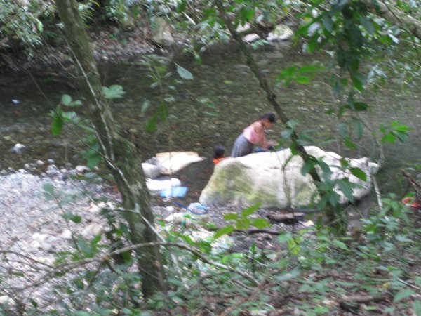 Young lady doing the family wash in the river.  We’ve seen this numerous times.  Some streams are quite crowded with ladies doing laundry.  