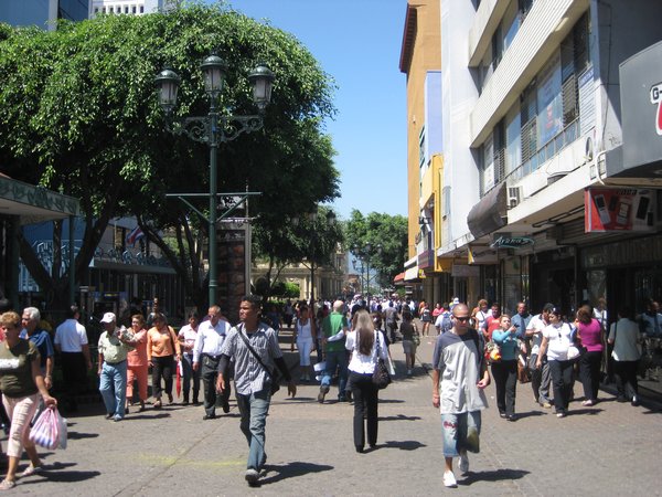 Busy Avenida Central on a weekday at 1:00 p.m.