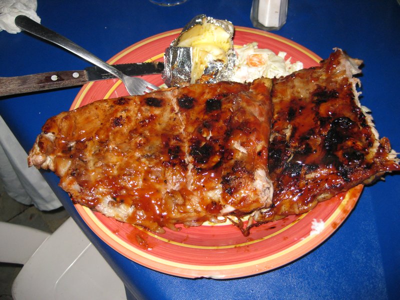 Two slabs of ribs, 14 ribs each only cost 150 pesos or about $13.00 with baked potato and coleslaw.