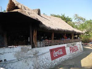 Beachside bar and restaurant popular with Mexicans serving huge drinks is at the far left end of the beach.