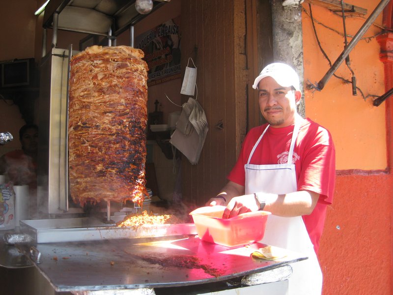 Tacos al pastor.   Four tacos and a coke and all the condiments we could pile on cost 42 pesos – about $3.25. 