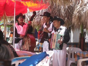 Mariachis performing at neighboring table.