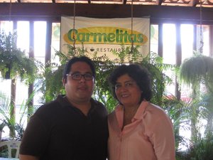 Carmelita and son Paco at her restaurant.