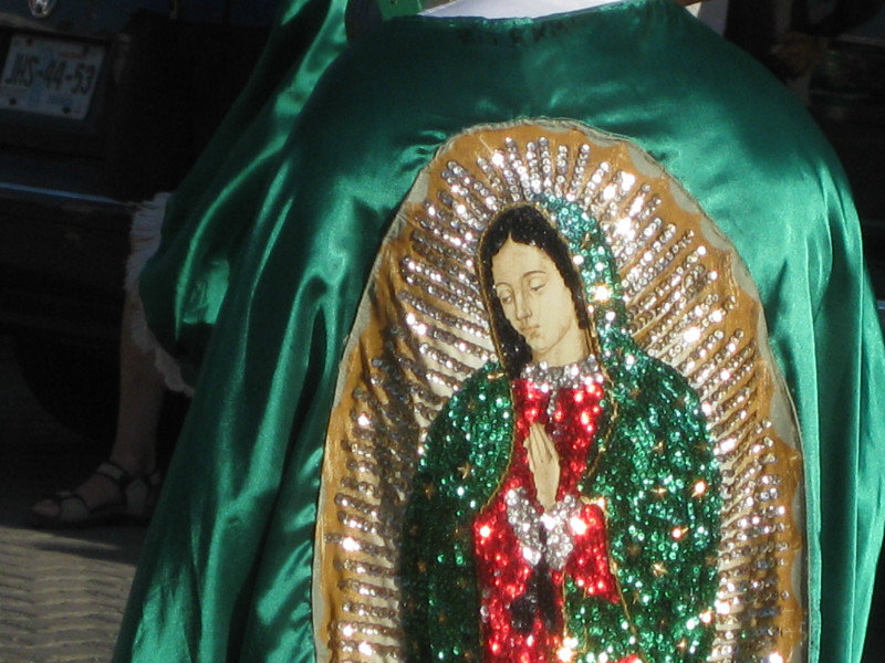 The Virgin of Guadalupe on capes of some marchers.  