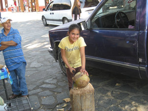 This little gal was using a machete to open coconuts.  She agreed to the photos.