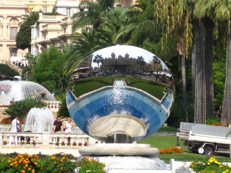 In the reflection of this mirrored sculpture is the Casino Monte Carlo