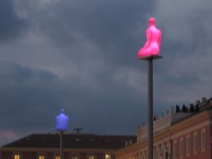 These statues, illuminated with various rotating colors by night, marked that one was in Place Massena.