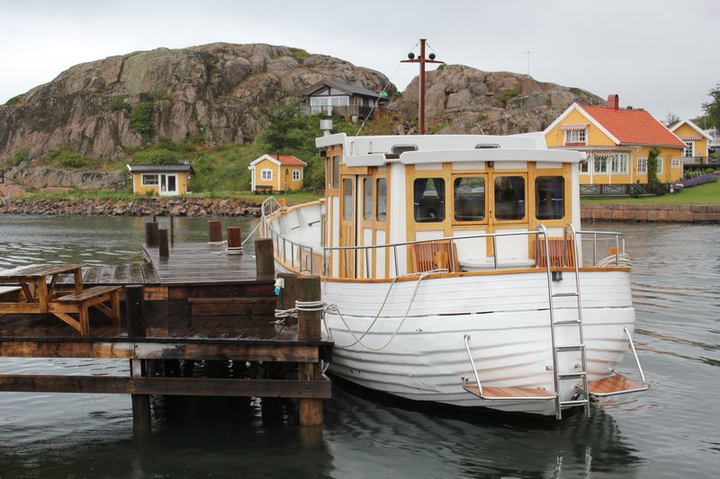 Whether a cool old boat like this or a fancy yacht, every waterfront home has a boat parked outside