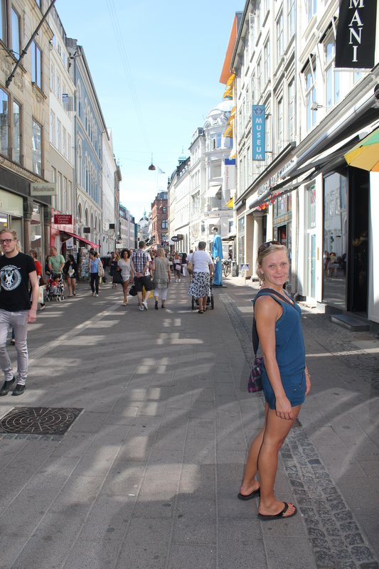 Adina walking down Stroeget, a busy pedestrian street with endless fine stores for those who like to shop