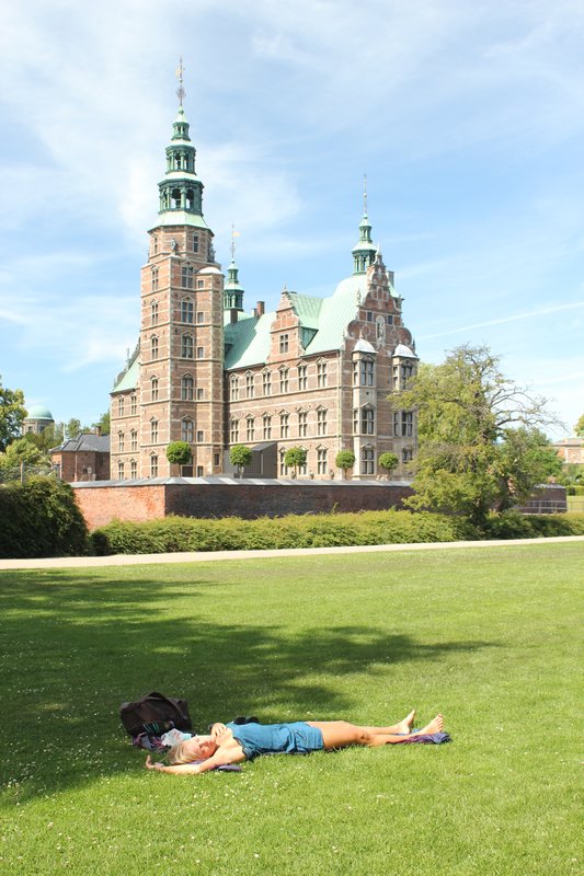 Adina takes a nap outside Rosenborg castle.