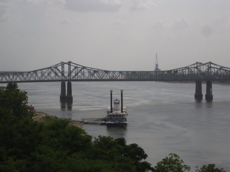 Bridge from Louisiana to Natchez, MIssisisippi with a riverboat casino in the foreground 