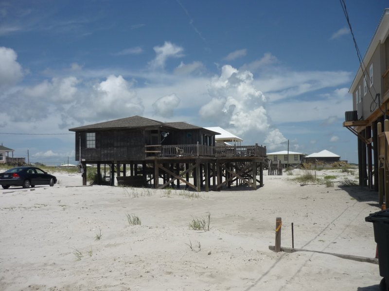 Dauphin Island was a few miles long, lined with residential homes built on stilts like this one