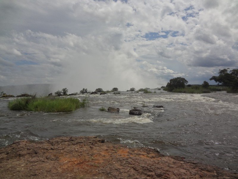 Falls from above on the Zambia side, notice the mist rising.