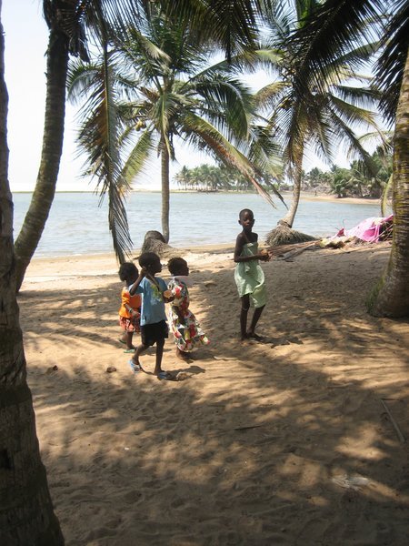 Children gawk at the Obruni.