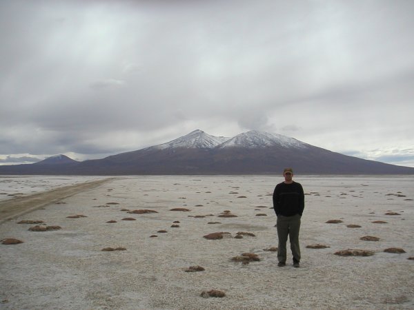a light layer of snow covers the road thru the Bolivian Altiplano