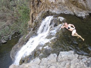 swinming at the edge of 150 m waterfall
