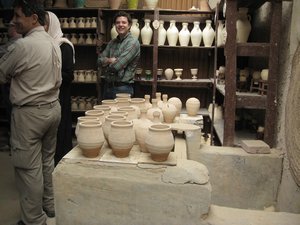 Hal and Tom inspect the pottery