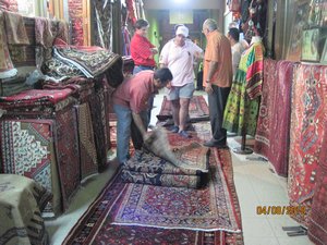 Peter buying a Persian carpet