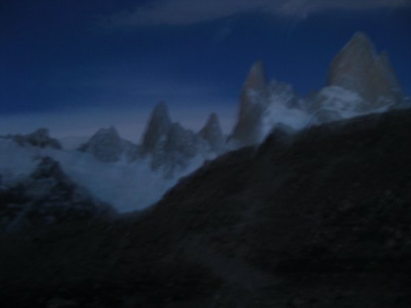 torres at the summit of Cerro Fitz Roy at the start of sunrise