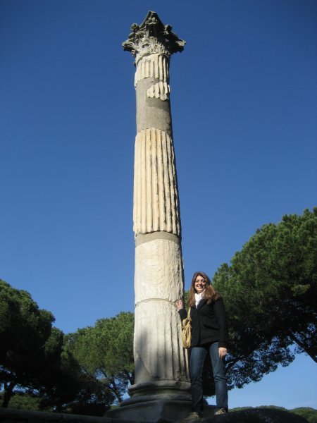 Laura against pillar