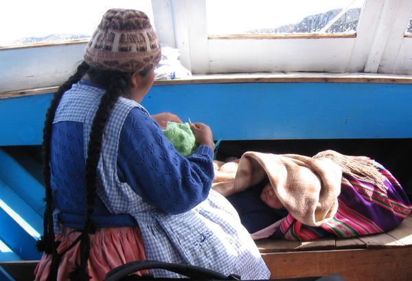 Multi tasking Bolivian woman