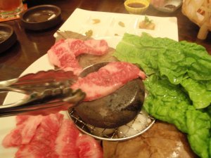 Cooking beef on a hot stone.