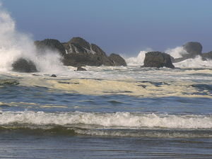 Waves crash over rocks at Seal Rock Beach
