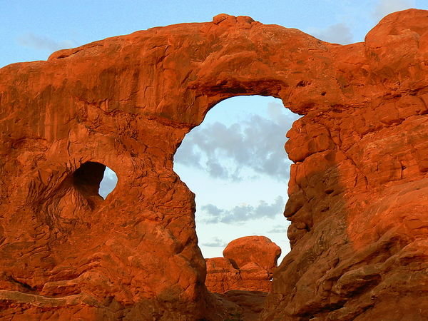 Turret Arch reflects the sunrise
