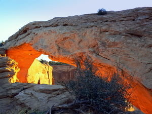 The rising sun lights up Mesa Arch