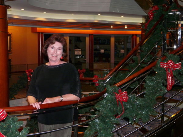 Standing beside a festive railing