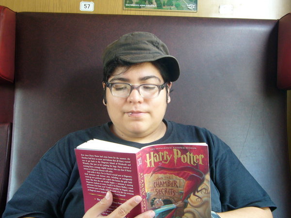 reading harry potter on the train to serbia