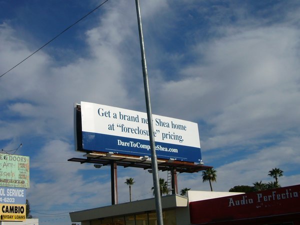 billboards about foreclosed houses