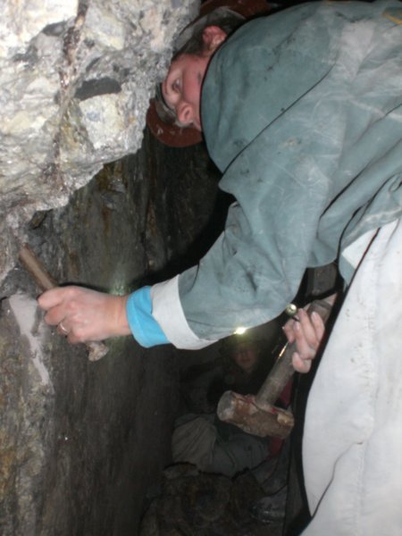 Lou helping make a hole for the dynamite